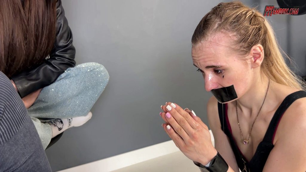 Spit-covered face of a pathetic slave girl close-up lezdom